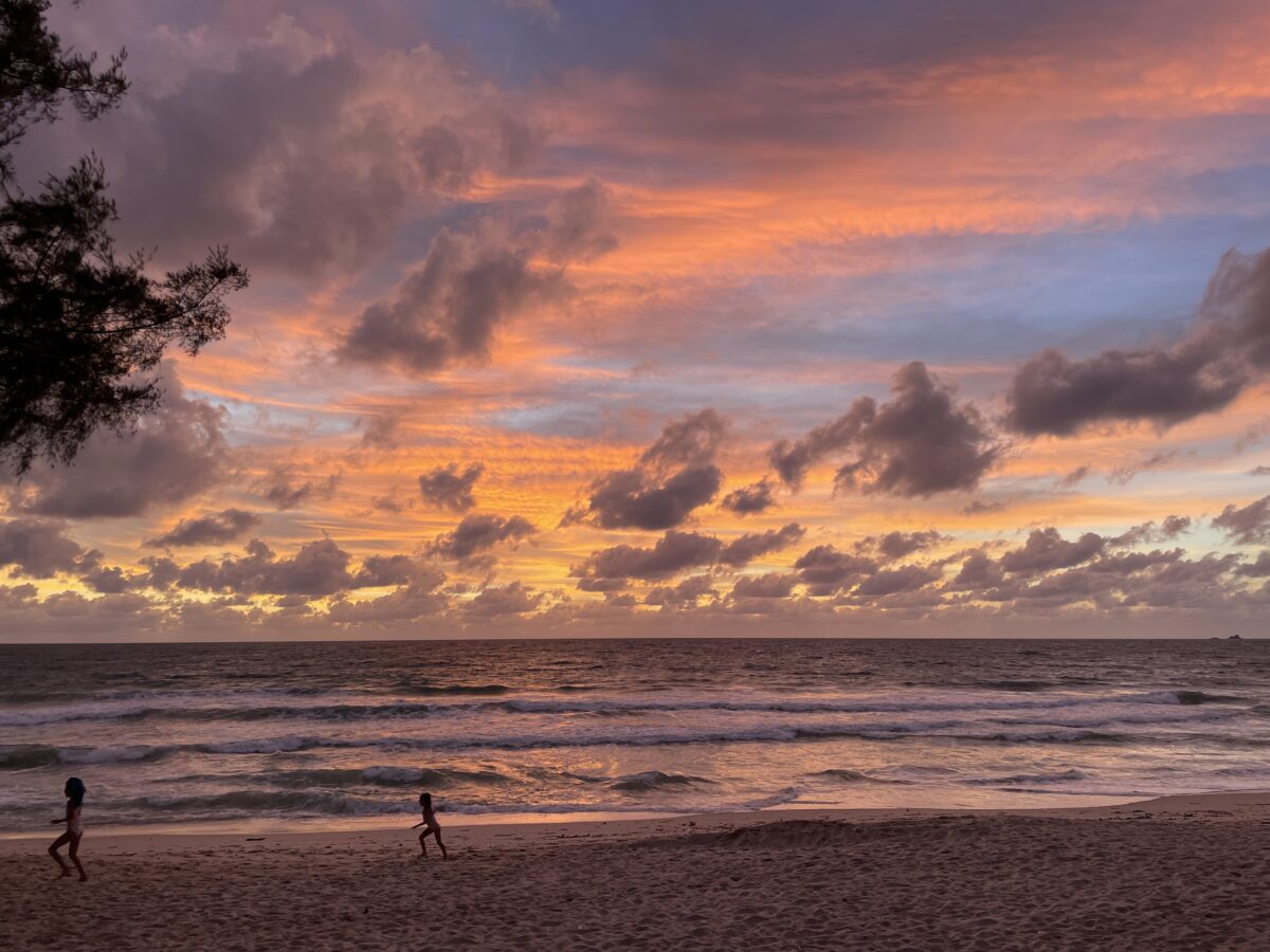 Children running in sunset